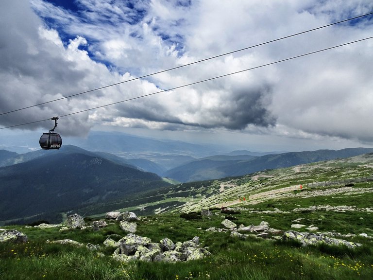 A Cable Car is driving near to the peak