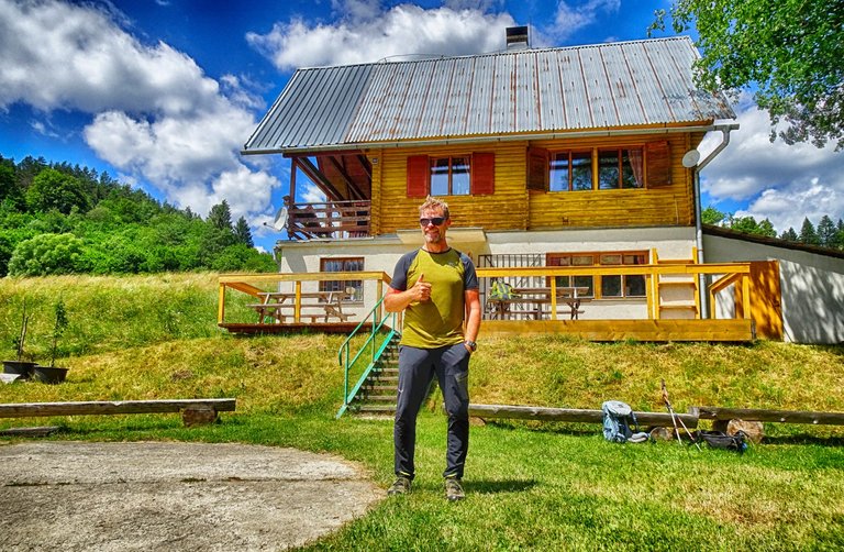 Marko Weiss in front of hin cabin
