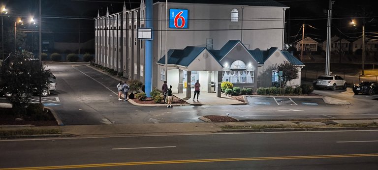 Long Stays in front of their motel in Calhoun