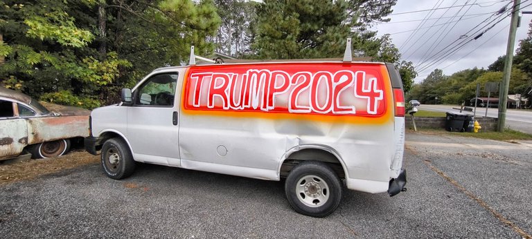 An old man with an old car is riding for an old President