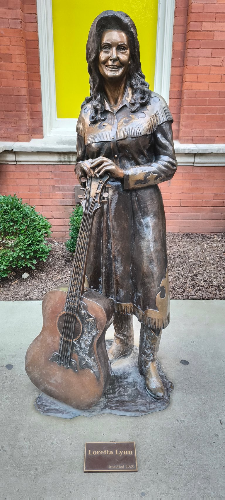 Loretta Lynn with her guitar