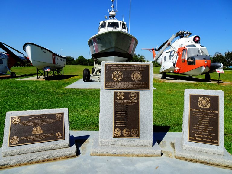 An exhibition of boats and helicopters waits outside