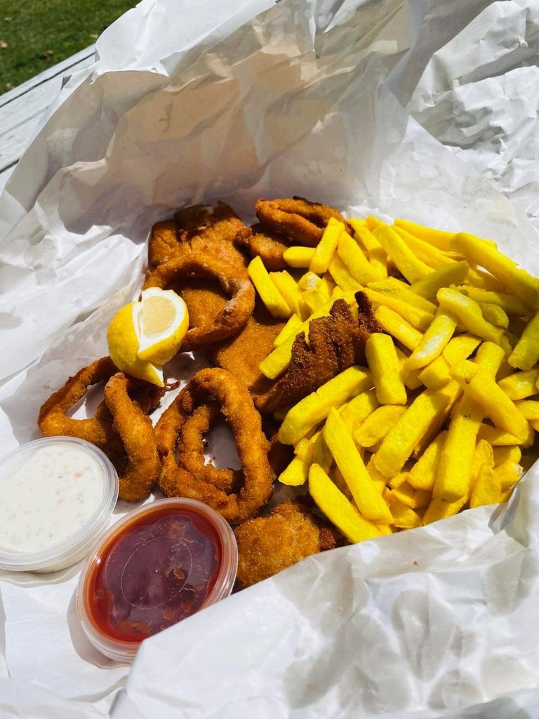 Crumbed Cod, Calamari, Sea Scallops, and a scoop of chips.