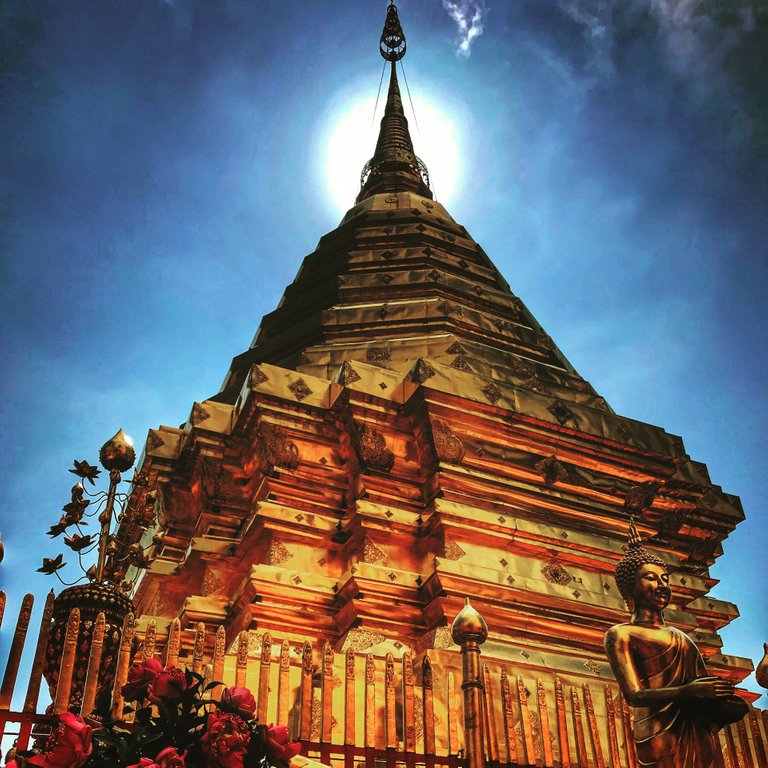 The sun is setting over Wat Phra That Doi Suthep