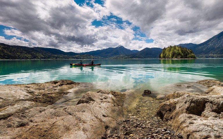 Kayakers at lake Walchensee in the German Alps