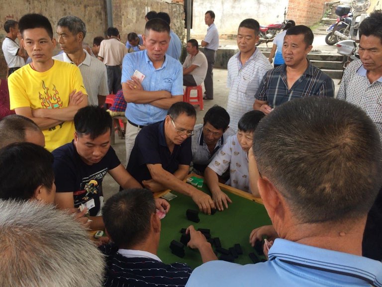 The Guys were playing some table game. Well, gambling obviously. LOL.