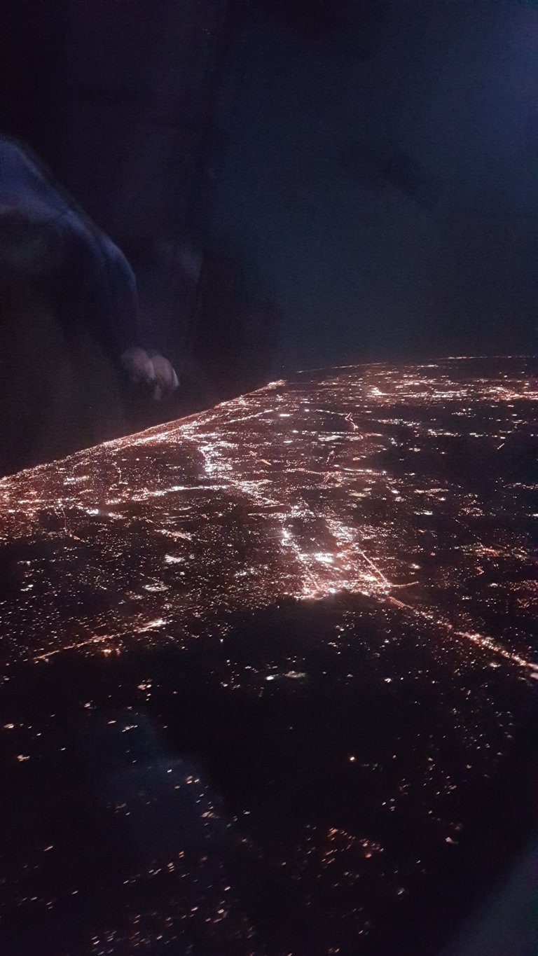 Flying into New York after a long haul flight from Brisbane via LAX. This was somewhere over Baltimore (if I can remember correctly from what the pilot told us). The consistent number of lights I would see was amazing compared to how spread out city lights are in Australia. After landing in New York City we changed flights and then flew onto Washington DC.