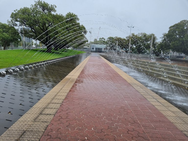 A walk through water fountain. It did not really matter if I got wet as it had been raining most of the day and I was saturated from running around out in it.