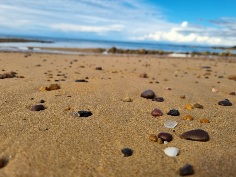 And the beaches there were full of smooth, round, worn rocks of various colours. It made the beach look like a work of art.