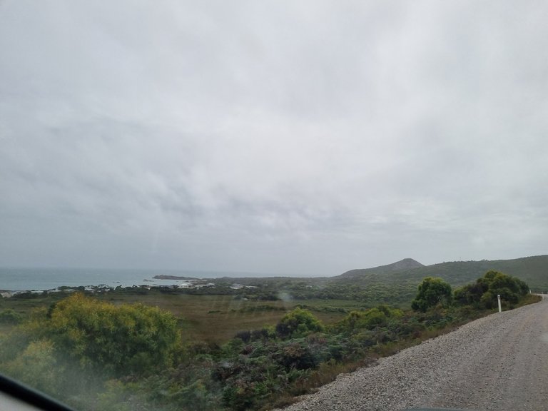 A few houses situated near a protected bay within the national park. They must have been built before it was classed as national park.