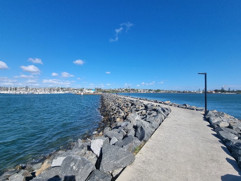 The break wall out into the Bay to protect all the expensive boats.