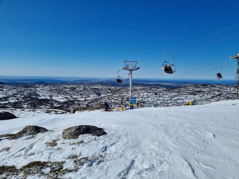 The Perisher triple chair in the foreground and the old double chair behind.