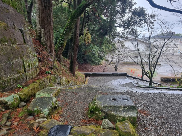 Basically you walk up this mossy stone path and stairs to a hill top.