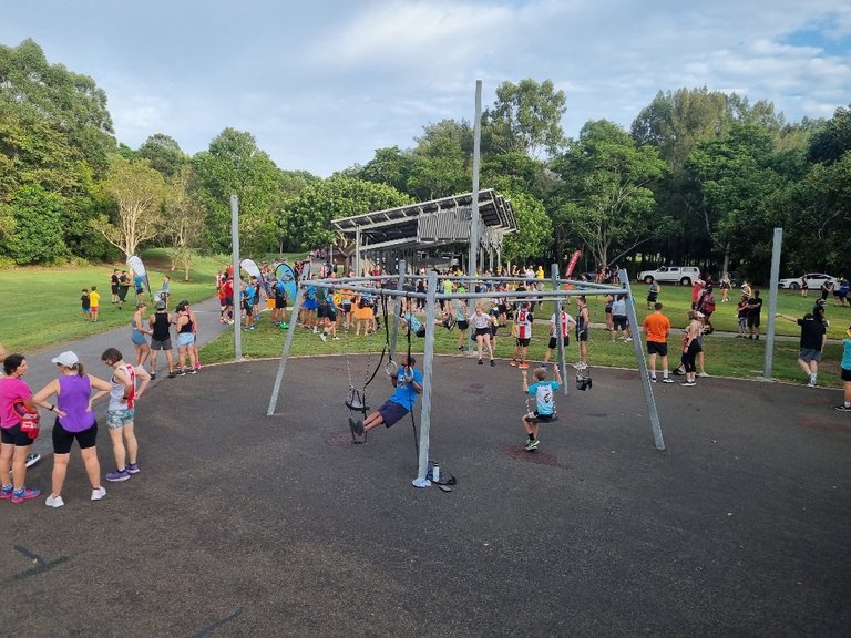 The parkrun crowd gathering and warming up.