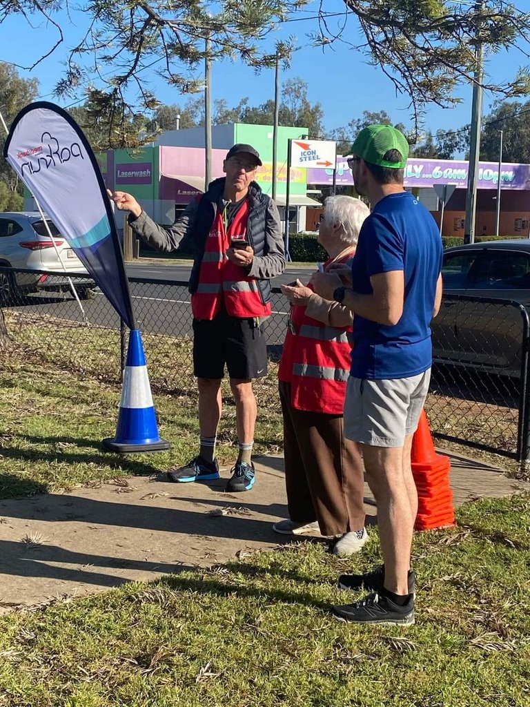 Me telling the event director and finish token volunteer that I could have been first finisher if not for my ankle. Everyone is a winner at parkrun but there is still only one first finisher LOL