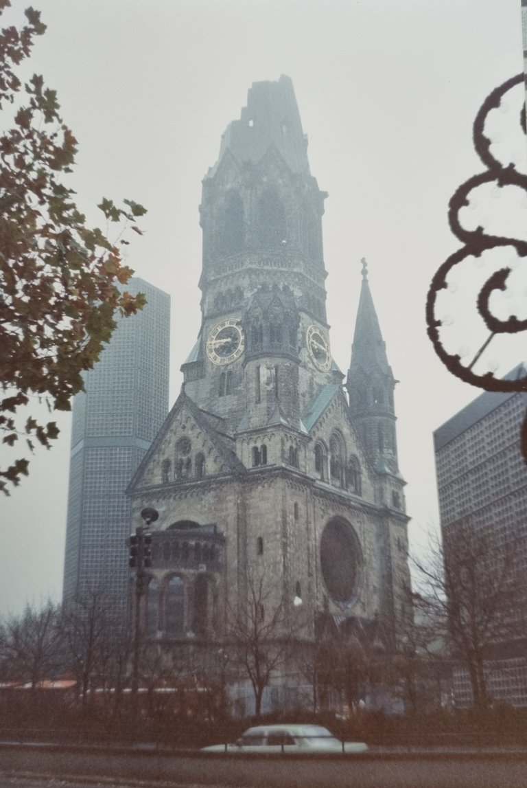 Getting off a train in the fog and walking past the Kaiser Wilhelm memorial Church to the Berlin Youth Hostel thinking I had time travelled.