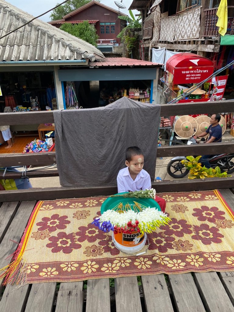 Mon’s tribe boy is selling flowers