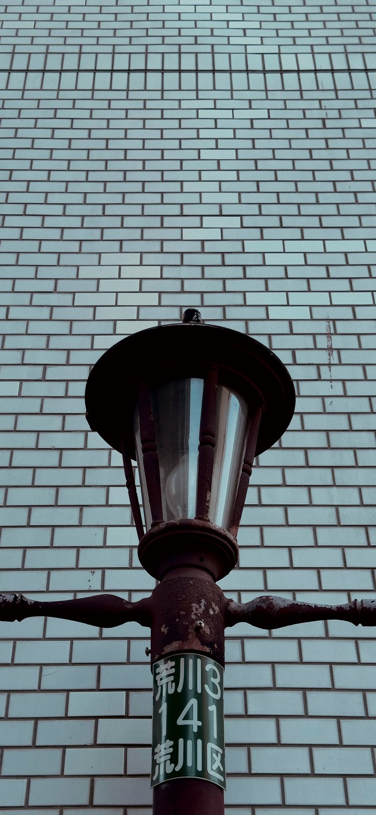 Rusty old lamp with its location exposed