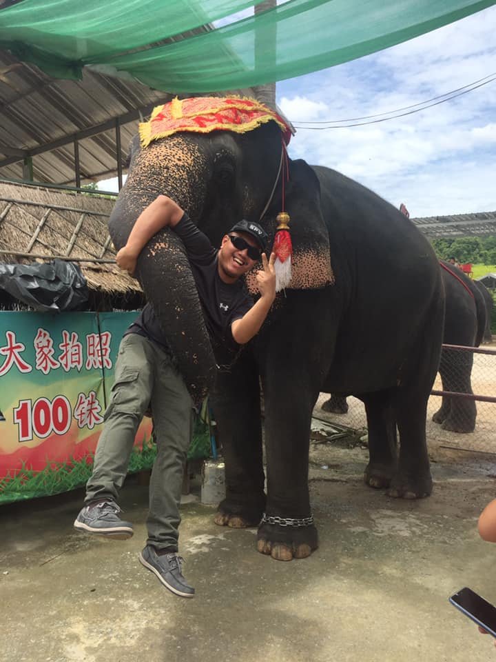 An elephant carrying me through it’s nose in Thailand