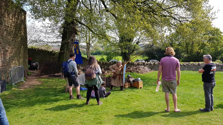 A picture of a reenactor explaining how medieval soldiers used the spear and shield combo.