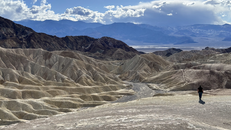 Zabriskie Point (foreground), with view of Death Valley (center, flat area) and Panamint Mts (background)