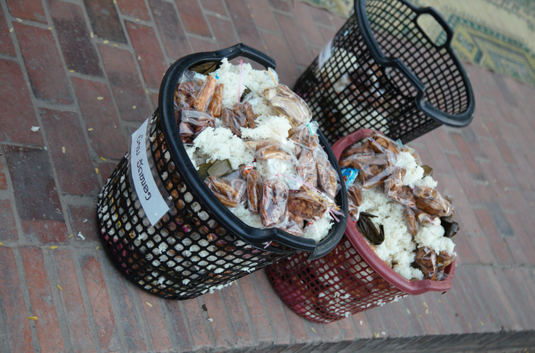 The monk put out some food to reduce stuff in their container 