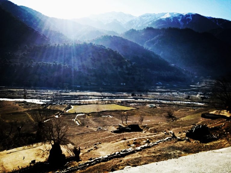 Sun rays refraction with Mountains