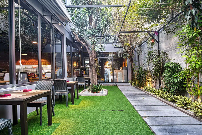 Alfresco dining under the canopy can be a dream come true. The only downside is this fake grass carpet.