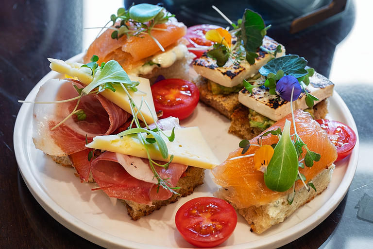 Grilled cheese with avocado mousse, Salmon with herbal curd and prosciutto canapés