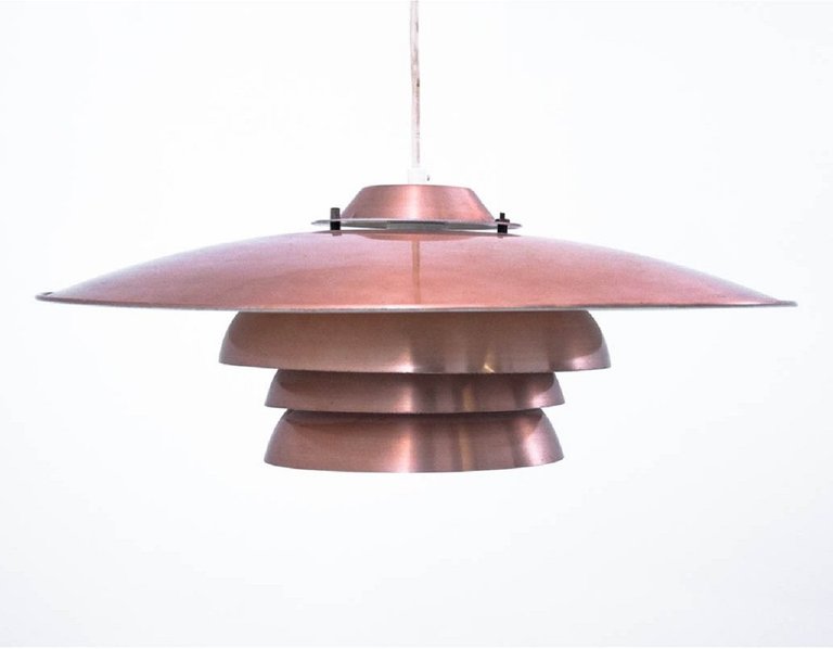 As learned from narcissistic Danish design culture - aim of all lamp creation - to make look like spaceship - this basically law (source embedded)