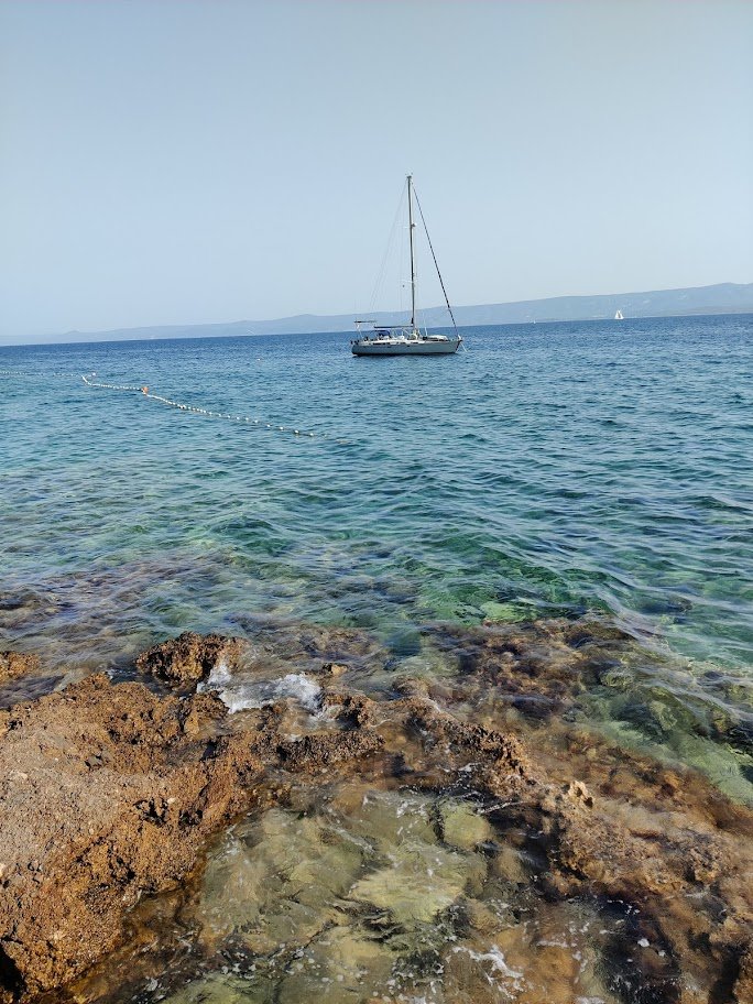 A sailboat and the neighboor island of Hvar