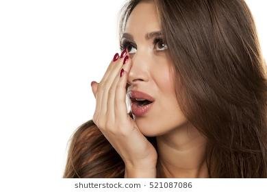 young-woman-checking-her-breath-260nw-521087086.jpg