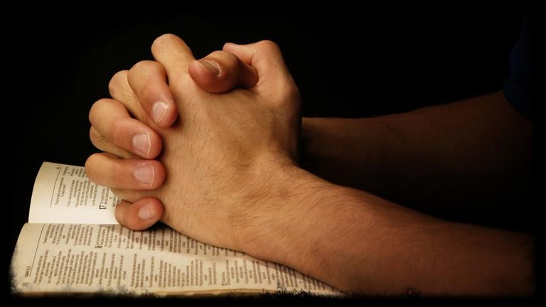 praying-hands-on-scripture.jpg