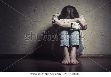 stock-photo-young-sad-woman-sitting-alone-on-the-floor-in-an-empty-room-719619349.jpg