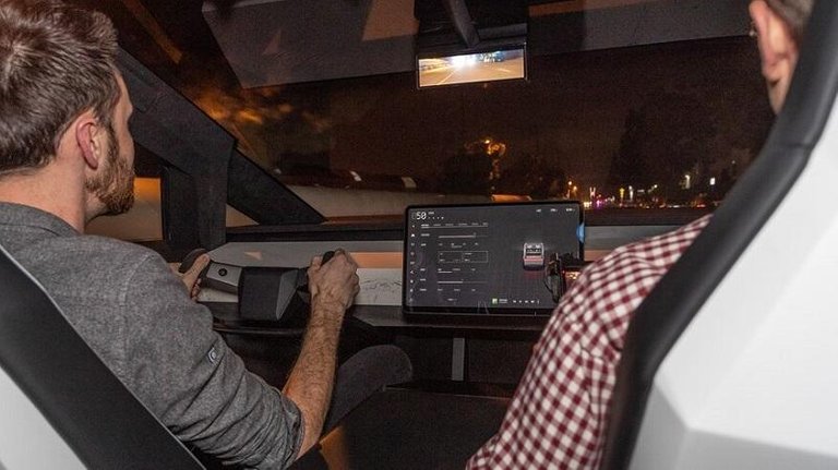 Tesla-Cybertruck-electric-pickup-interior-from-back-seat.jpg
