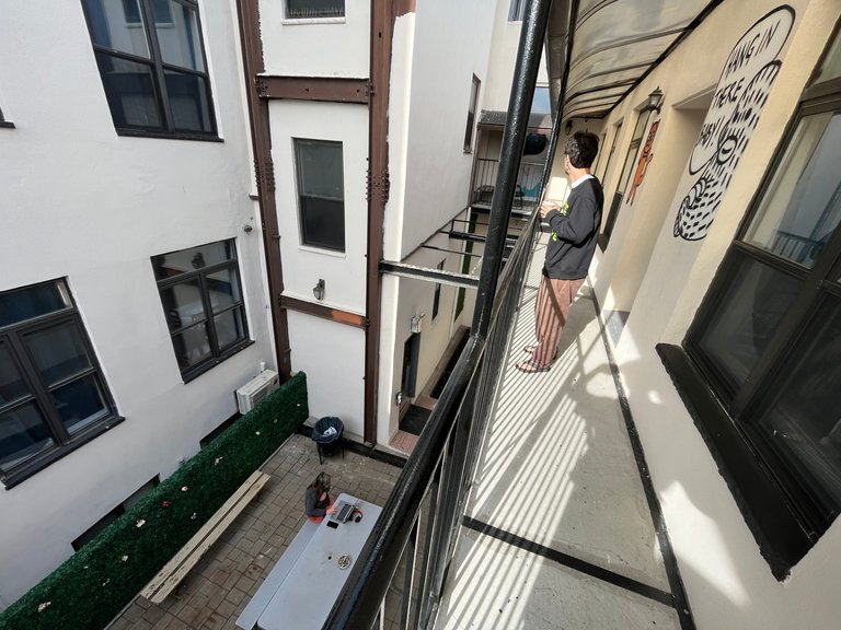vlad enjoys our little outdoor balcony at the hostel