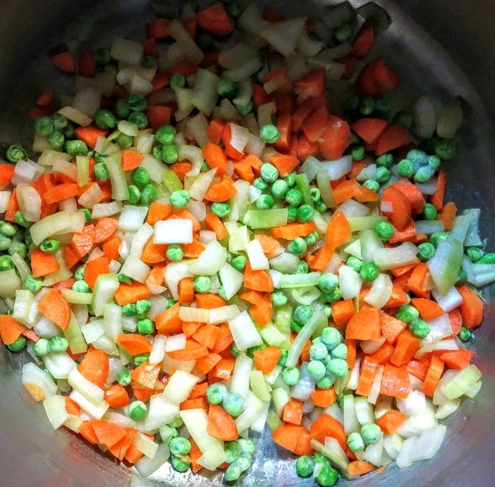 Onions, carrots and peas, soon to be followed by potatoes in Oleg’s soup!