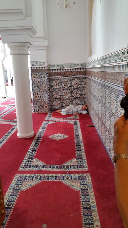 Woman sleeping in a mosque