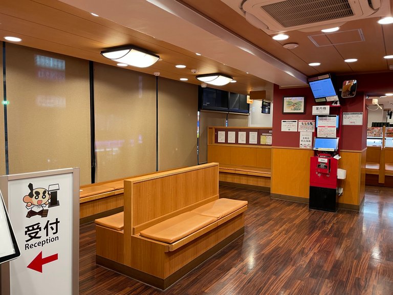 reception and waiting area in Kura Sushi Shinjuku branch