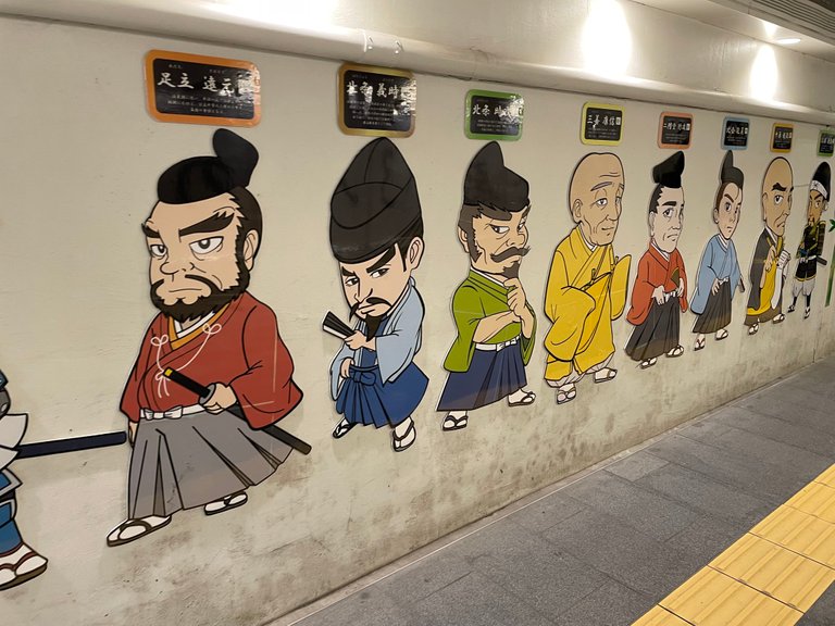 Noticable artwork of shoguns inside Kamakura station