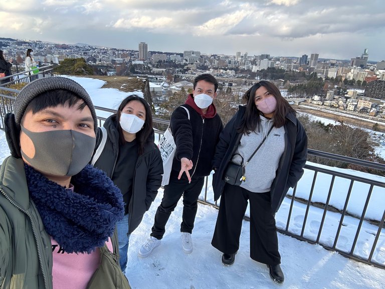 Group photo of course with Sendai City on the background. Photo from my friend