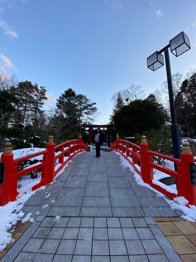 The vivid orange or red bridge in the shrine grounds