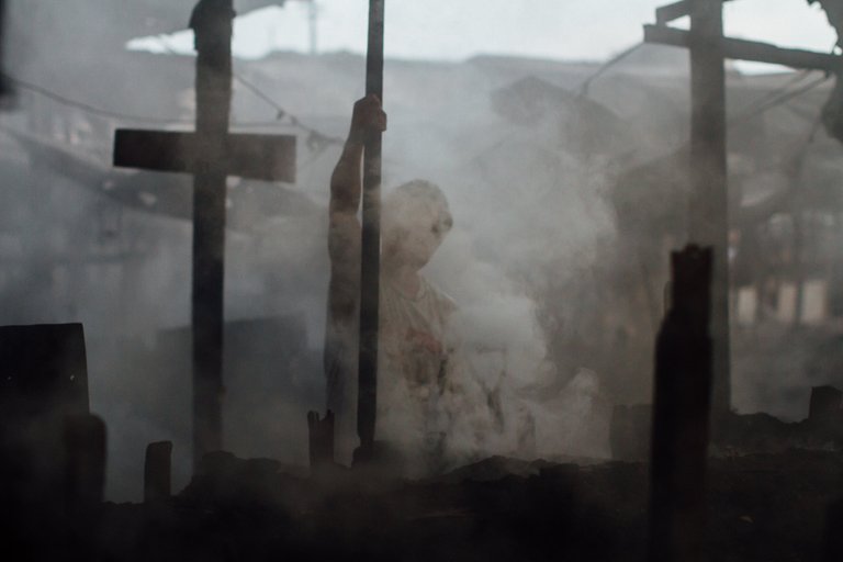 Silhouette in Smoke From Charcoal Manufacture, Unlingan Manila
