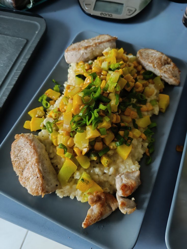Risotto with zucchini corn topping and turkey minute steaks