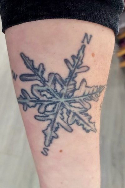 Travel tattoo idea snowflake compass