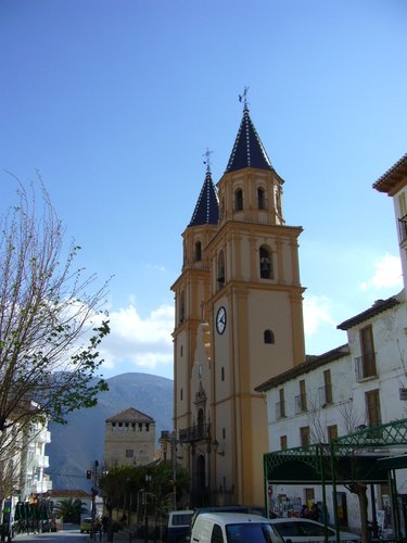 Orgiva main street looking down towards the local town council offices.