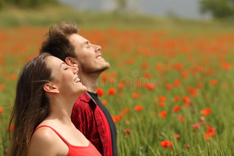 happy-couple-breathing-fresh-air-red-field-colorful-poppy-flowers-54718911.jpg