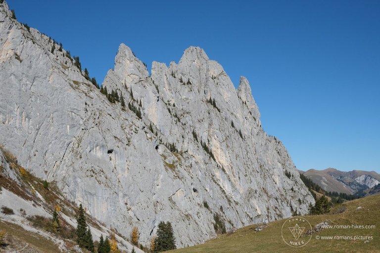  " "View of Melchzähne peaks during the 'Gastlosen Tour' hike (Schweizmobil 262) - There are some indentations in the mountainside that look like half-drilled holes.""