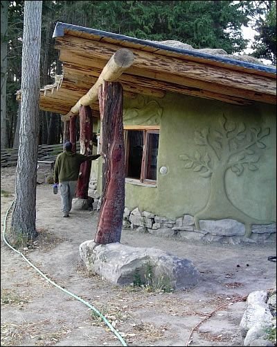 Image of cob house with large overhanging roof