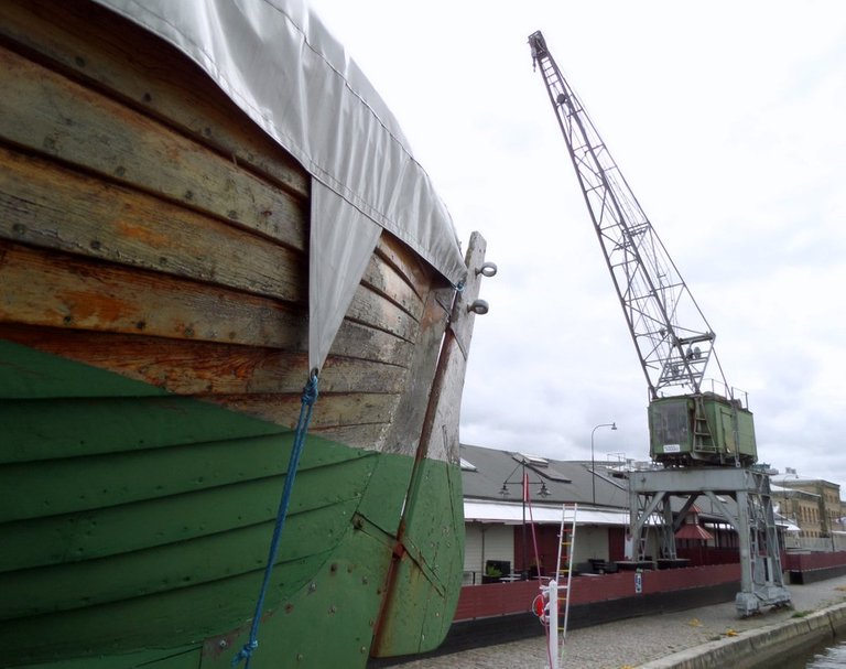 Wooden boat and crane